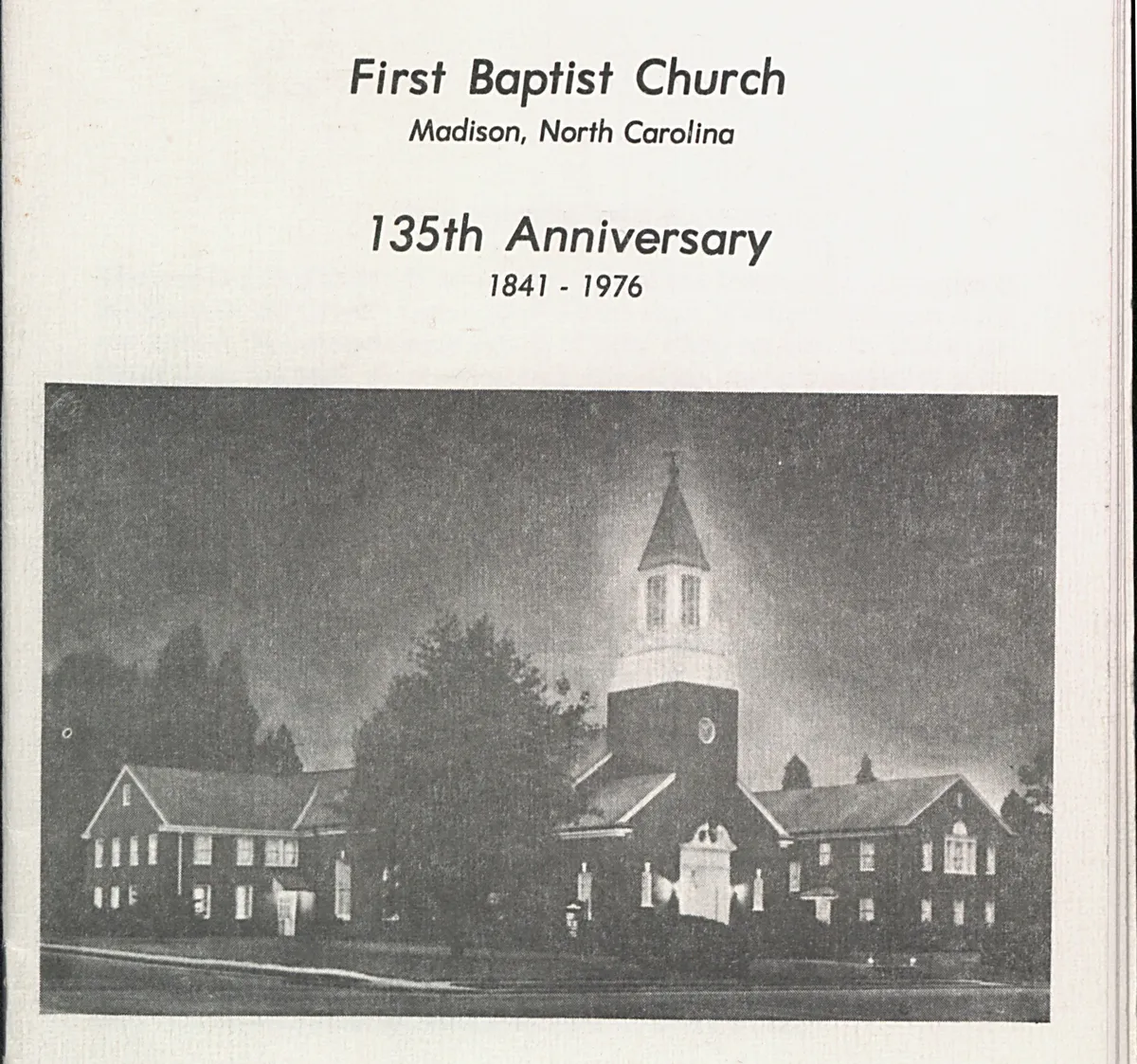 The cover of a printed church anniversary program reading First Baptist Church, Madison, North Carolina, 135th Anniversary, 1841 to 1976, above a night photo of the lit brick church and steeple